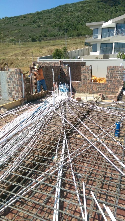 Conduit runs laid over reinforcing steel before a slab is poured