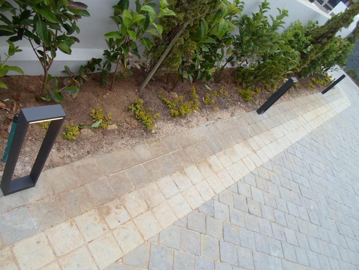 Bollard lights along a paved garden path