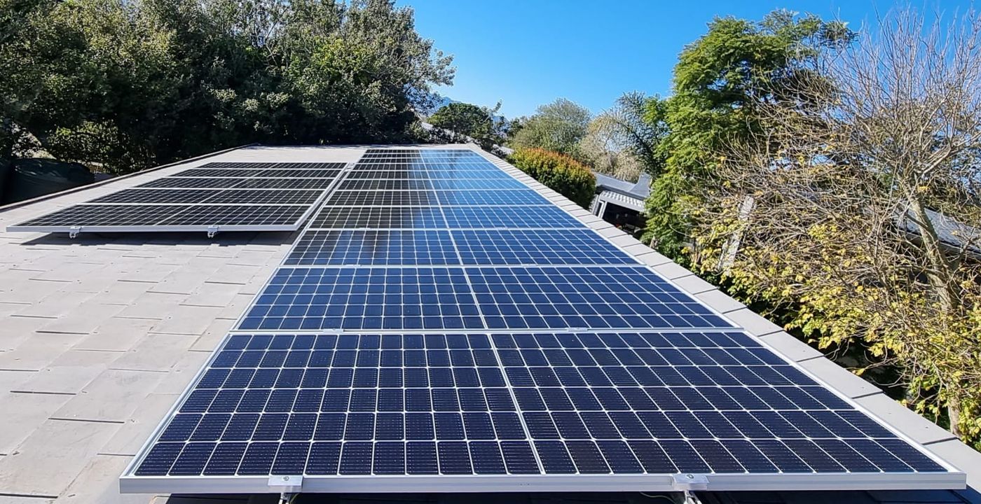 A row of solar panels installed on a roof