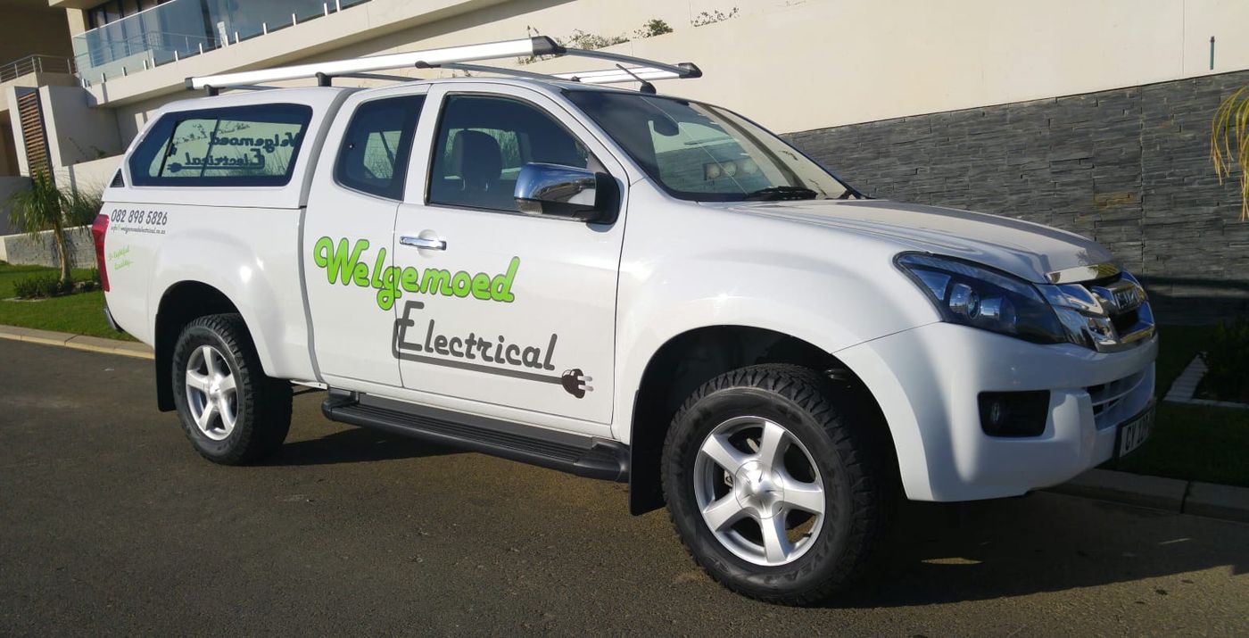 A white Welgemoed Electrical bakkie with the company logo on the door